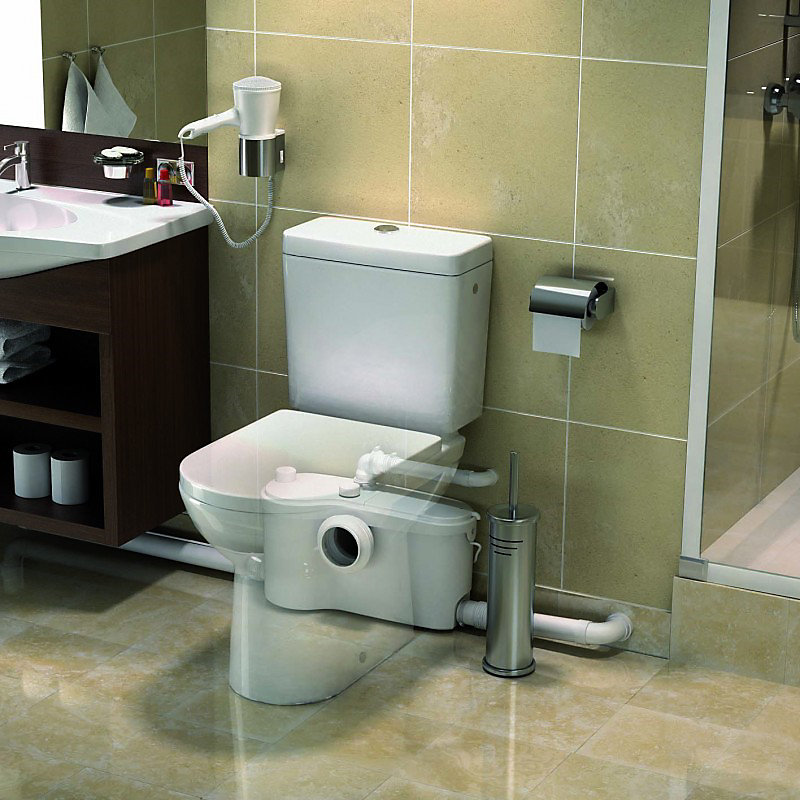 Saniflo macerator unit installed at the base of a toilet