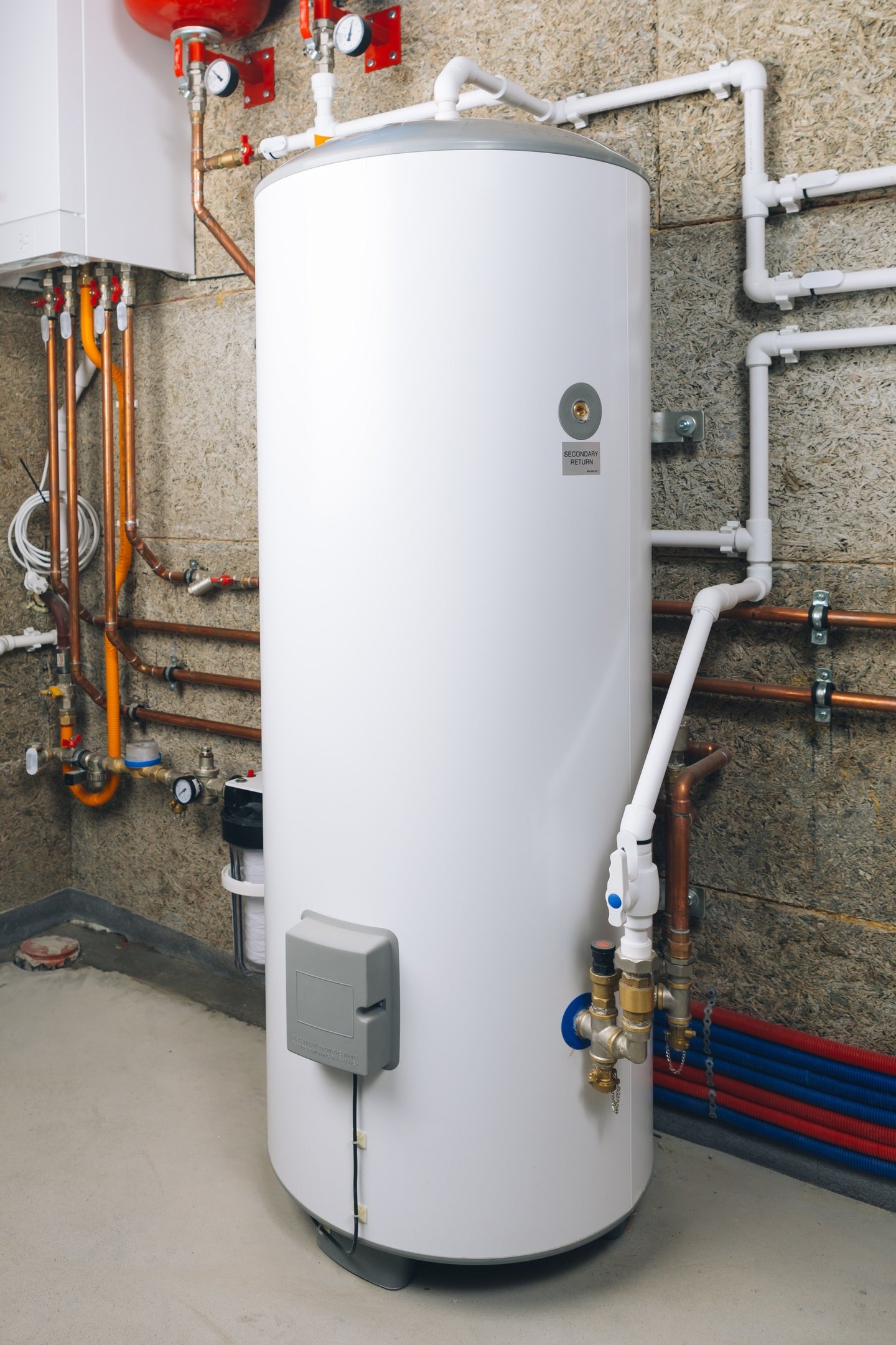 Professionally installed unvented hot water cylinder with copper pipework